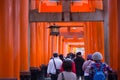 Tourist walk and see Red torii at Fushimi Inari-taisha shrine