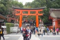 Tourist walk and see Red torii at Fushimi Inari-taisha shrine