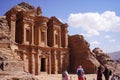 Tourist walking around beautiful Roman architecture of the Ad Deir one of the most iconic monuments in the Petra Archaeological