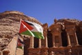 Tourist walking around beautiful Roman architecture of the Ad Deir one of the most iconic monuments in the Petra Archaeological