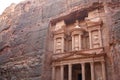 Tourist walking around beautiful Roman architecture of the treasure one of the most iconic monuments in the Petra Archaeological