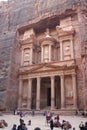 Tourist walking around beautiful Roman architecture of the treasure one of the most iconic monuments in the Petra Archaeological