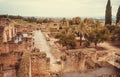 Tourist walking around gardens of the 10th century city in ruins. Moorish palace Medina al-Zahra in Andalucia