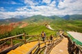 Tourist is walking on the trestle road of Qilian Zhuo Mountain.