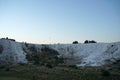 Tourist walking on white travertines terrace of Pamukkale landscape Royalty Free Stock Photo