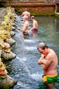 Tourist was washed his body at the Bali Holy Spring Water Temple Royalty Free Stock Photo