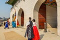 Tourist watching the warriors of the Royal guard in historical costumes in daily Ceremony of Gate Guard Change near the