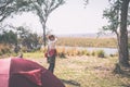 Tourist watching wildlife by binocular from camping site on Chobe River, Namibia Botswana border, Africa. Chobe National Park Royalty Free Stock Photo