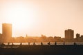 Tourist at the wave breaker on Havana during sunset