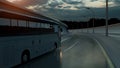 Tourist white bus driving on a highway at sunset backlit by a bright orange sunburst under an ominous cloudy sky. 3d Rendering Royalty Free Stock Photo