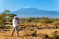 Tourist in a white T-shirt takes pictures