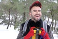 Tourist in winter background with vintage camera