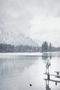 Tourist at winter mountain lake Royalty Free Stock Photo