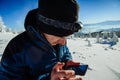 Tourist in winter mountains