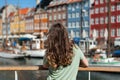 Tourist woman admiring the colored old houses Royalty Free Stock Photo