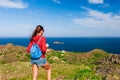 Tourist woman with backpack on Cap de Creus, natural park. Eastern point of Spain, Girona province, Catalonia. Famous tourist