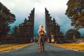 Tourist at vacation walking through the Hindu temple in Bali