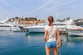 Tourist woman in Cannes, Cote d`Azur, France, South Europe. Nice city and luxury resort French riviera. Famous tourist destinatio Royalty Free Stock Photo