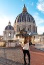 Rome - Tourist woman with close up view on the main dome of Saint Peter basilica in Vatican city, Rome, Europe Royalty Free Stock Photo