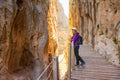 Tourist woman in El Caminito del Rey tourist attraction Malaga, Spain