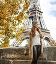 Tourist woman on embankment near Eiffel tower having excursion Royalty Free Stock Photo