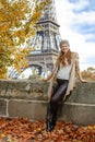 Tourist woman on embankment near Eiffel tower in Paris, France Royalty Free Stock Photo