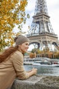 Tourist woman on embankment in Paris, France having excursion Royalty Free Stock Photo