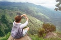 Tourist woman enjoy with beautiful view on mountains and valley in Ella Rock, Sri Lanka. Royalty Free Stock Photo