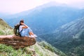 Tourist woman enjoy with beautiful view on mountains and valley in Ella, Sri Lanka, Little Adam Peak