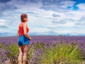 Tourist woman enjoys view of lavender fields, Provence France Royalty Free Stock Photo