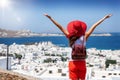 Tourist woman enjoys the view over Mykonos town, Cyclades, Greece Royalty Free Stock Photo