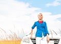 Tourist woman in front of car in summer field. Royalty Free Stock Photo