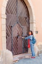 Tourist woman at gate of the old castle