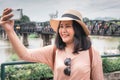 Tourist Woman Having Fun While Sightseeing in Travel Place, Asian Woman Relaxing and Enjoyment While Photographing Landmark of