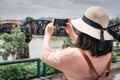 Tourist Woman Having Fun While Sightseeing in Travel Place, Asian Woman Relaxing and Enjoyment While Photographing Landmark of