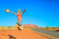 Uluru woman jumping Royalty Free Stock Photo