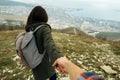 Tourist woman holding man's hand and leading him on nature Royalty Free Stock Photo