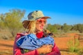 Woman holding baby kangaroo