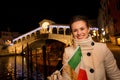 Tourist woman with Italian flag spending Christmas in Venice Royalty Free Stock Photo