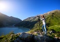 Tourist woman at the mountains at sunrise Royalty Free Stock Photo