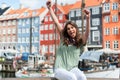 Tourist woman at the Nyhavn harbor pier Copenhagen, Denmark.