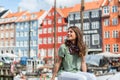 Tourist woman at the Nyhavn harbor pier Copenhagen, Denmark. Royalty Free Stock Photo