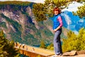 Tourist enjoying mountains fjord view, Norway Royalty Free Stock Photo