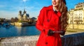 Tourist woman in Paris looking into distance and writing sms Royalty Free Stock Photo