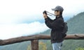 Tourist woman photographer taking nature photo of mountain landscape Thailand