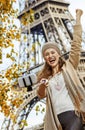 Tourist woman rejoicing and taking selfie on embankment in Paris Royalty Free Stock Photo