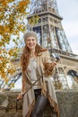 Tourist woman with selfie stick on embankment near Eiffel tower Royalty Free Stock Photo