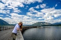 Tourist woman smiling into the camera on Salmon Arm Wharf, the longest freshwater wooden wharf in North America Royalty Free Stock Photo