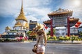 A tourist woman stands in front of the Chinatown Gate at Yaowarat Road Royalty Free Stock Photo