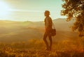 Tourist woman on summer Tuscany trip looking into distance